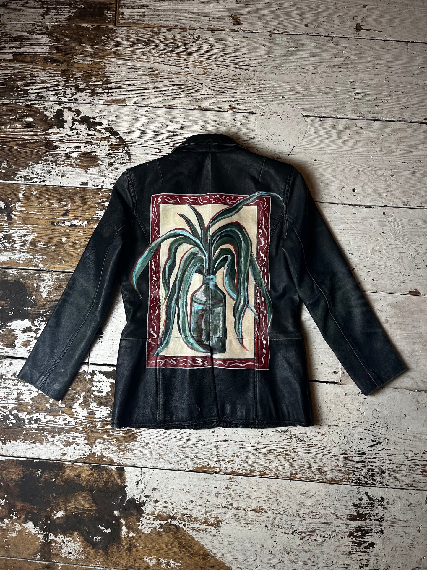 Vintage “Framed and Bottled” leather jacket by Anna Floto